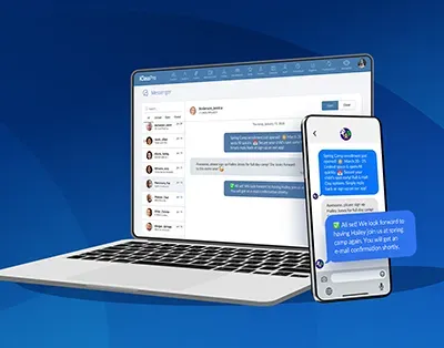 Laptop and smartphone displaying a blue messaging app