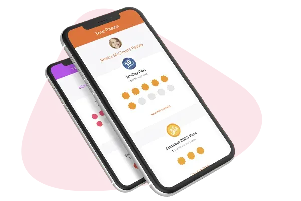 Two phones are sitting next to each other on a pink background.