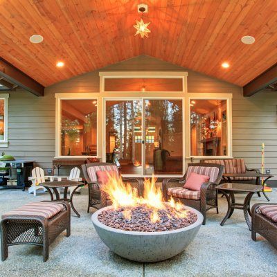 There is a fire pit in the middle of the patio.
