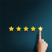 Person using a smartphone with floating chat bubbles and a 5-star rating icon on a blue background