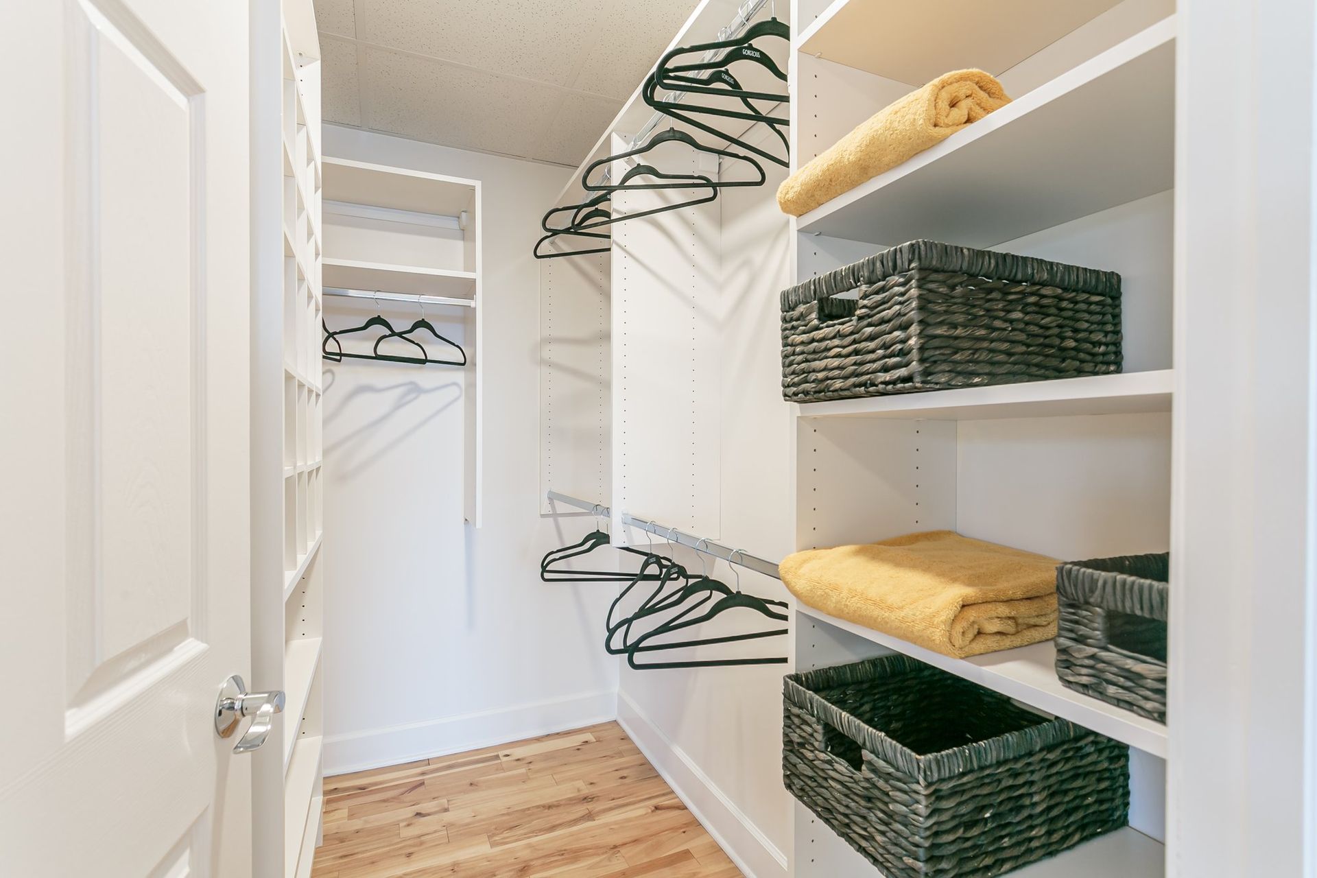 Large walk-in closet with built in shelving
