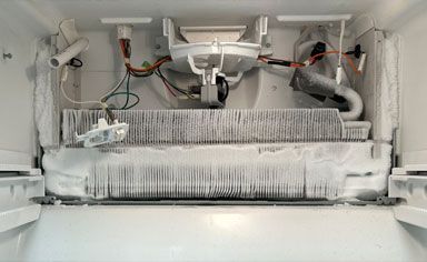 Frozen GE refrigerator evaporator coils