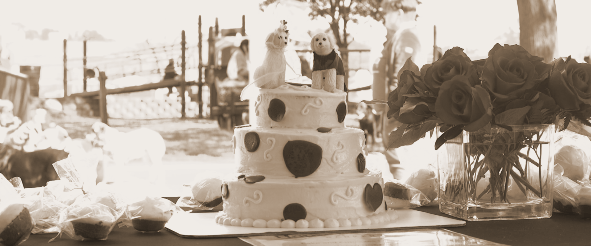 A black and white photo of a wedding cake on a table