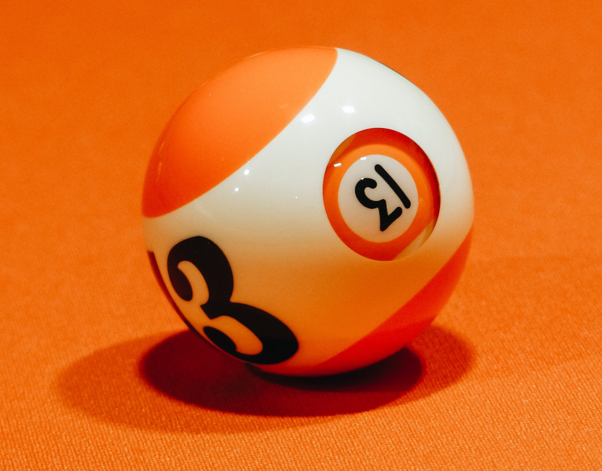 A pool ball with the number 13 on it