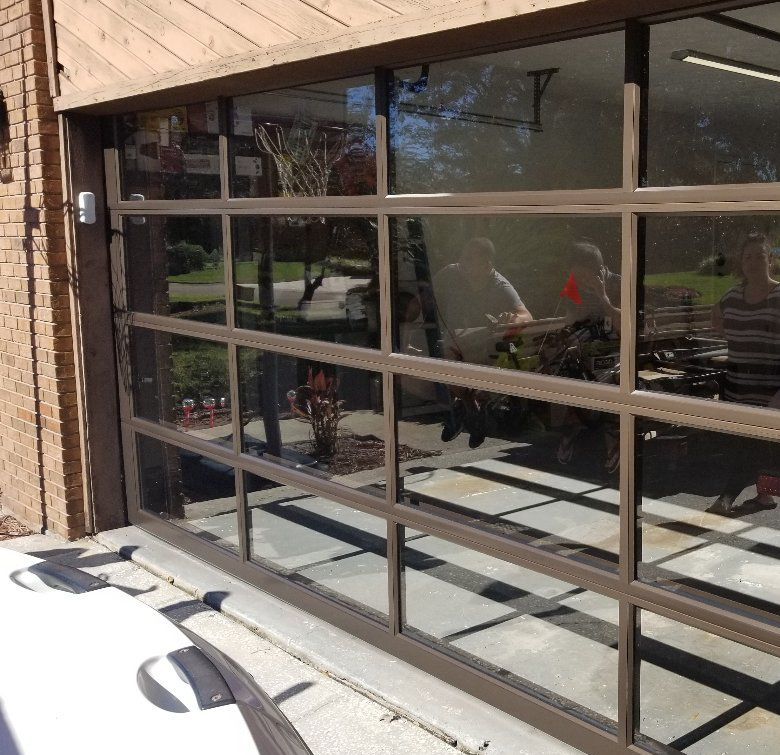 A garage door with a lot of windows and reflections