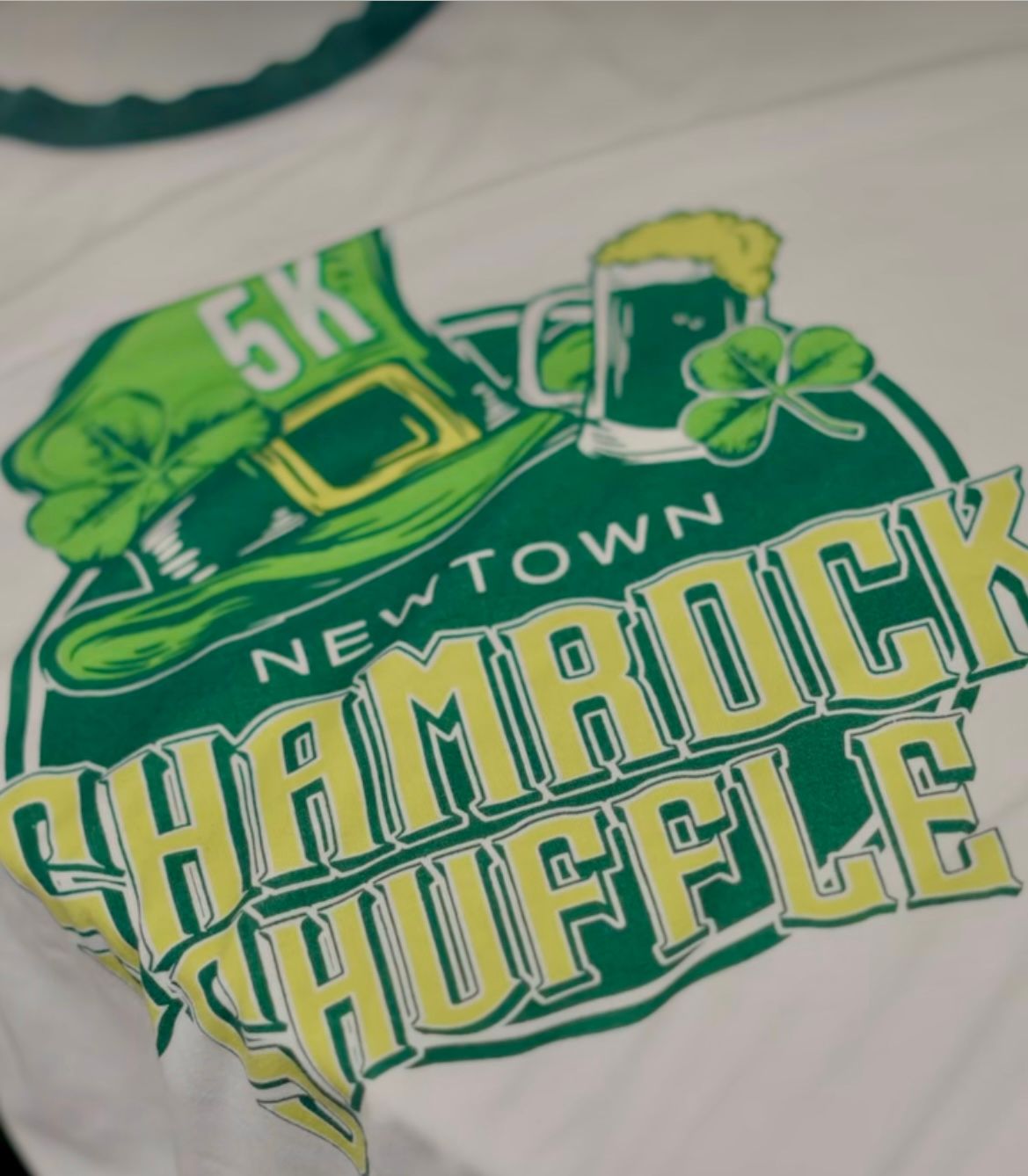 A shirt that says 5k newtown shamrock shuffle