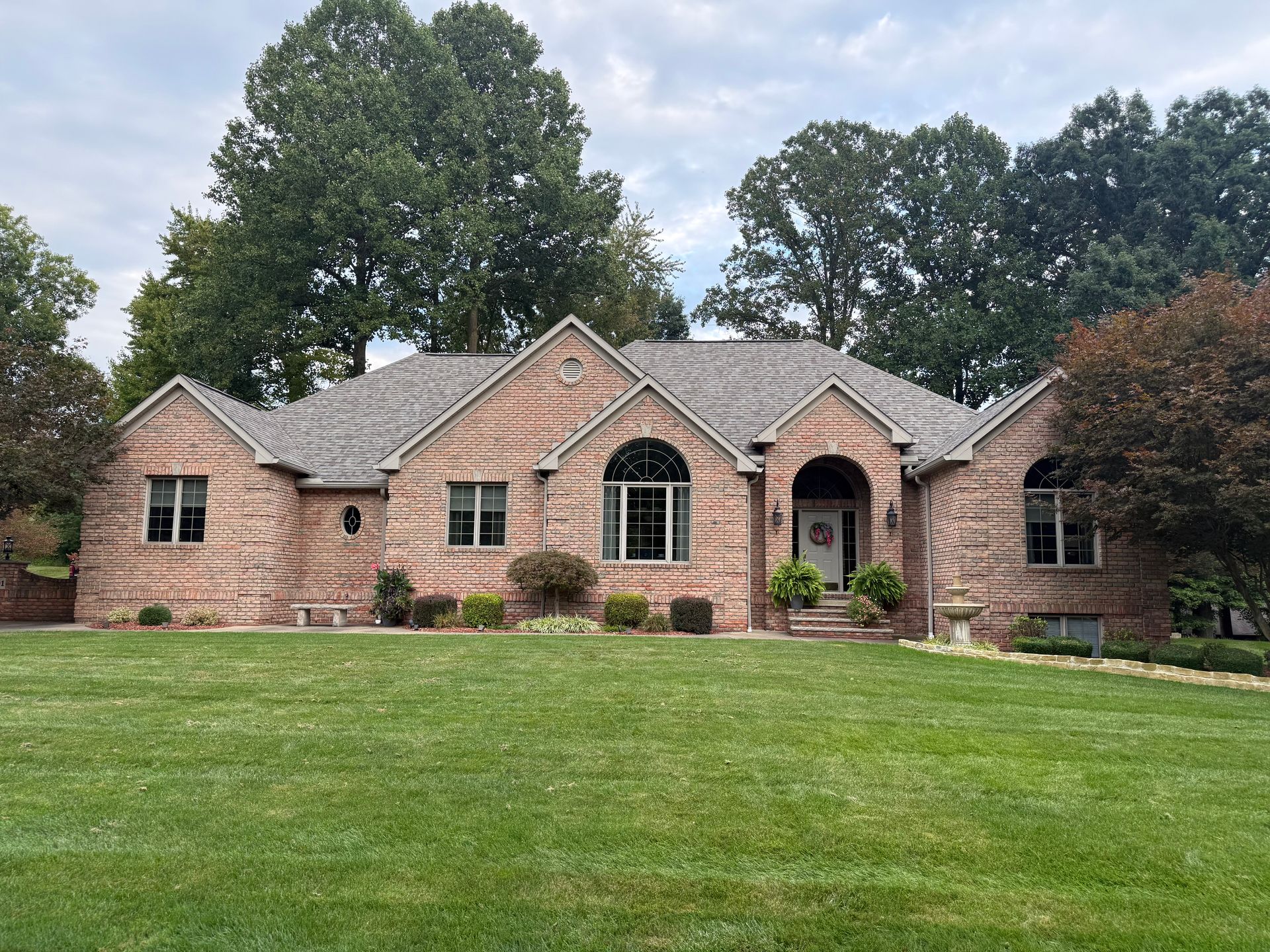 Completed residential roof replacement with gray architectural shingles in Kent, Ohio