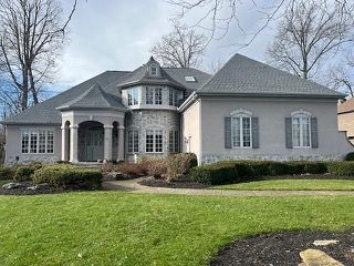 Large home with new asphalt shingle roof installed by professional roofing contractor
