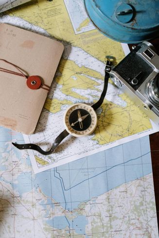 compass and maps on table - strategic planning