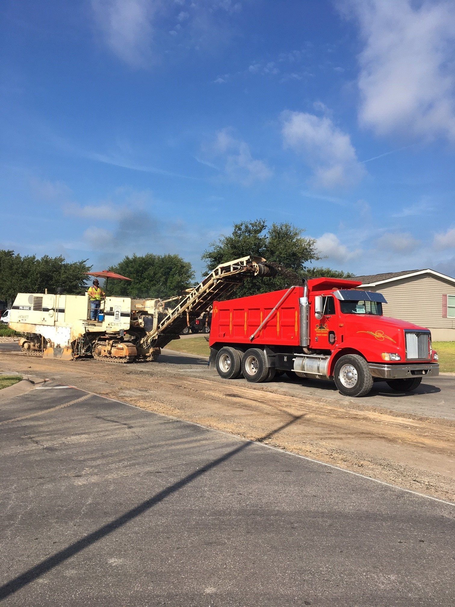 Two Different Trucks On The Road — Houston, TX — HEV Asphalt Paving Co.
