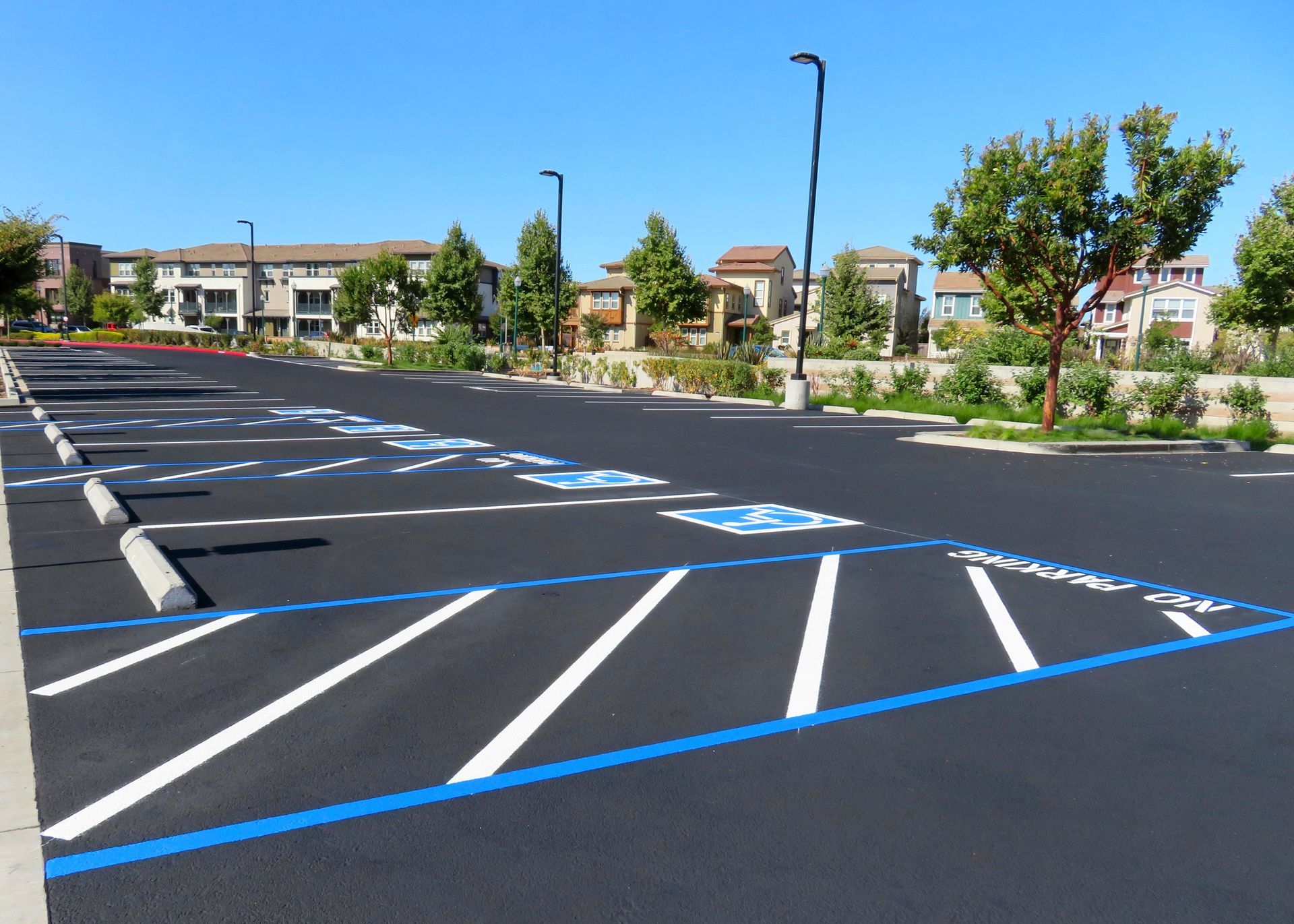 Freshly paved and repainted handicap parking lot. Freshly paved and repainted handicap parking lot.