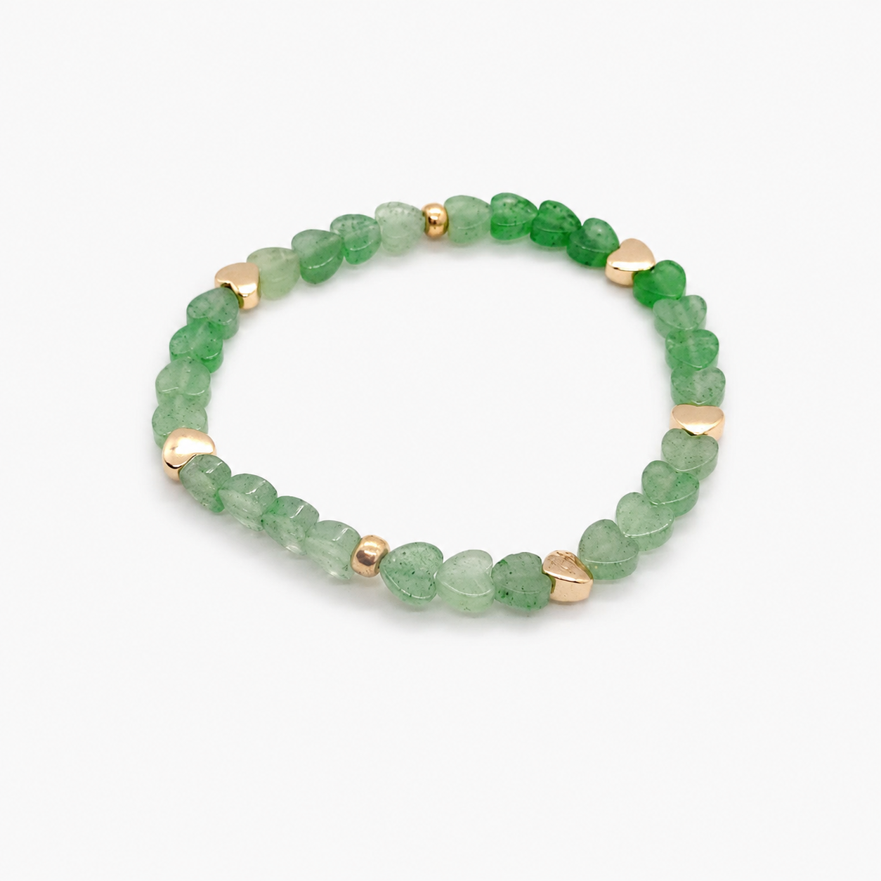 Armband met groene aventurijn hartjes en goudkleurige accenten