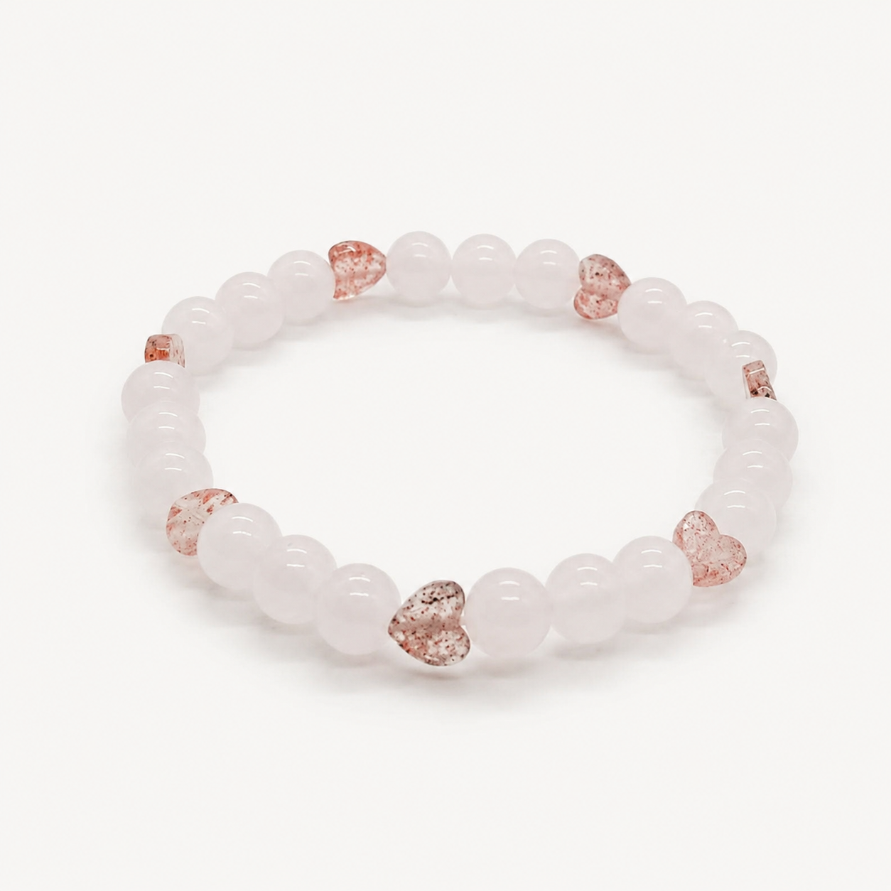 Armband met rozenkwarts kralen en aardbeienkwarts hartjes