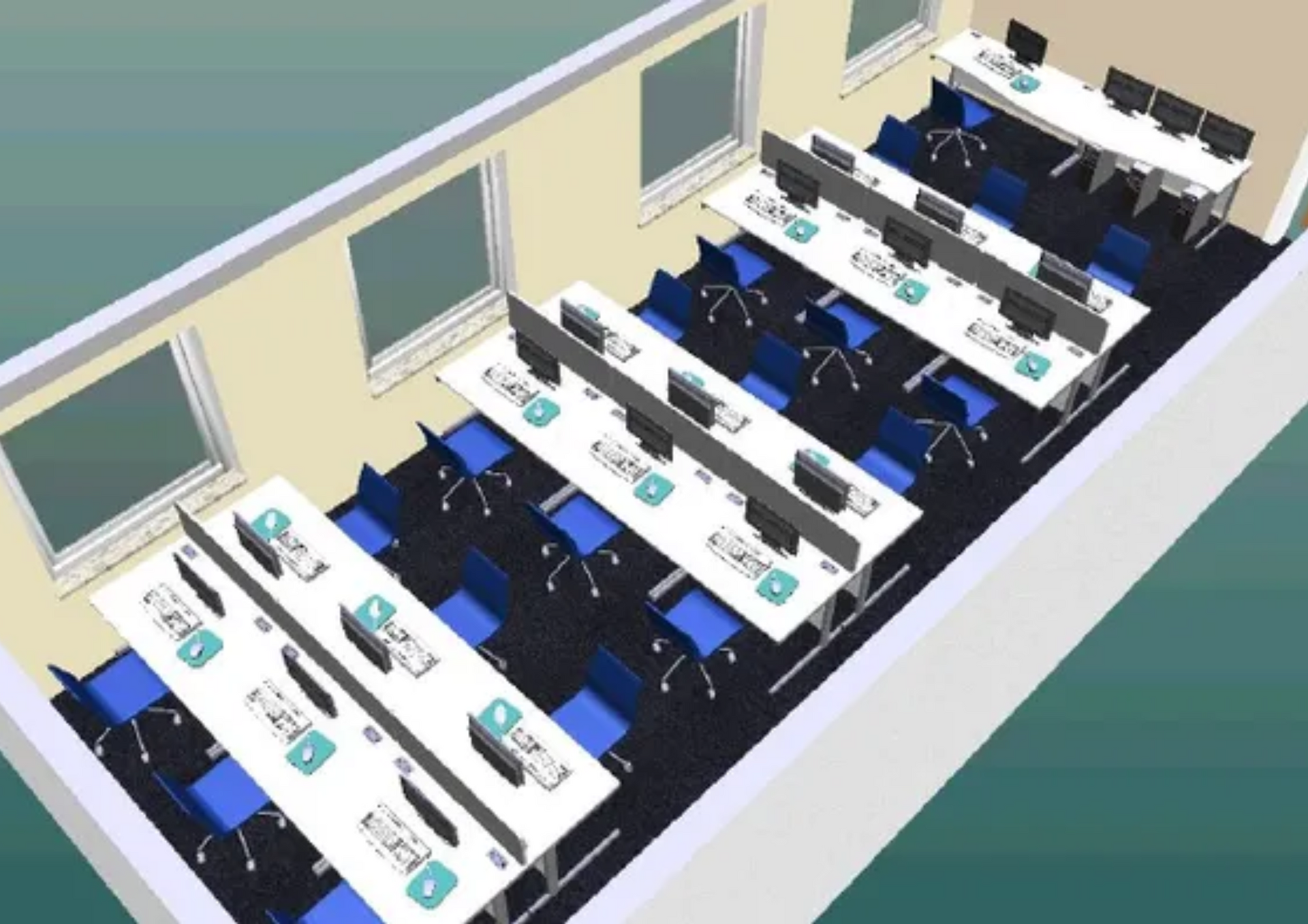 Empty computer lab with rows of desks, monitors, and blue chairs beside windows