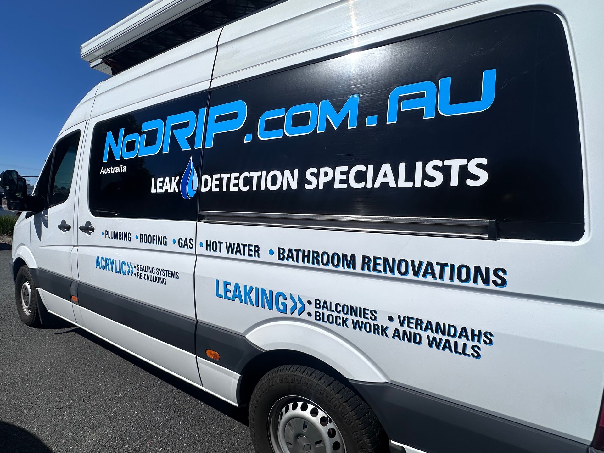 White plumbing service van with blue NoRIP.com.au leak detection and bathroom renovations branding