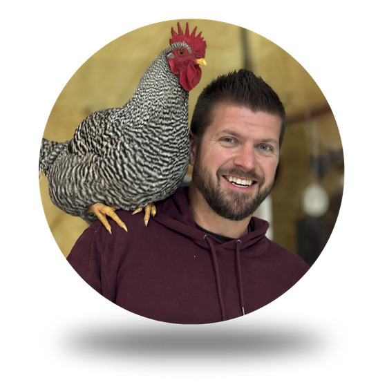 Jordan Timmerman, owner of Timmberman's Woodworking, with a rooster on his shoulder