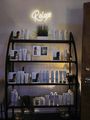 Shelving unit with beauty products, under a 