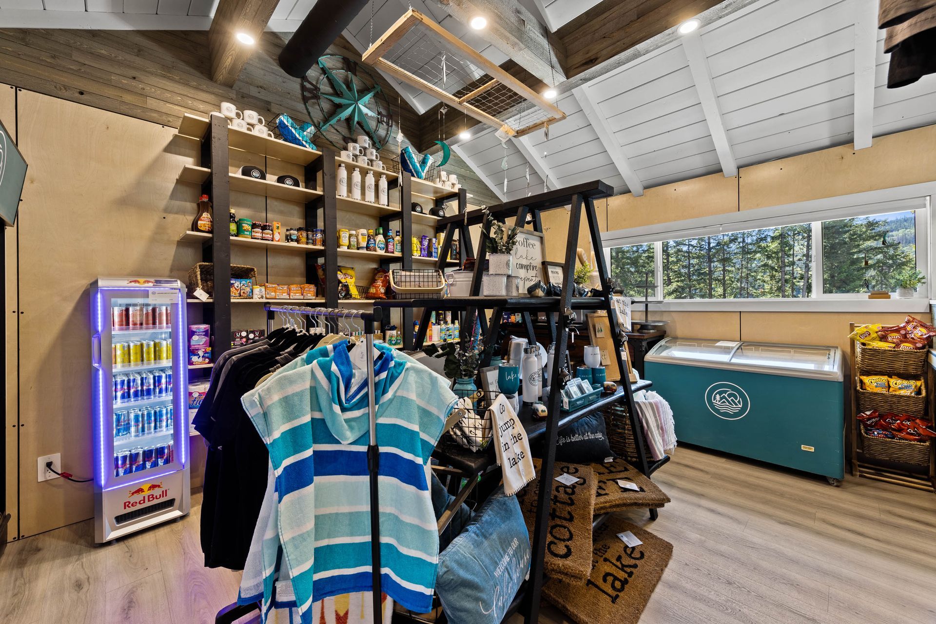 A store filled with clothes and a refrigerator.