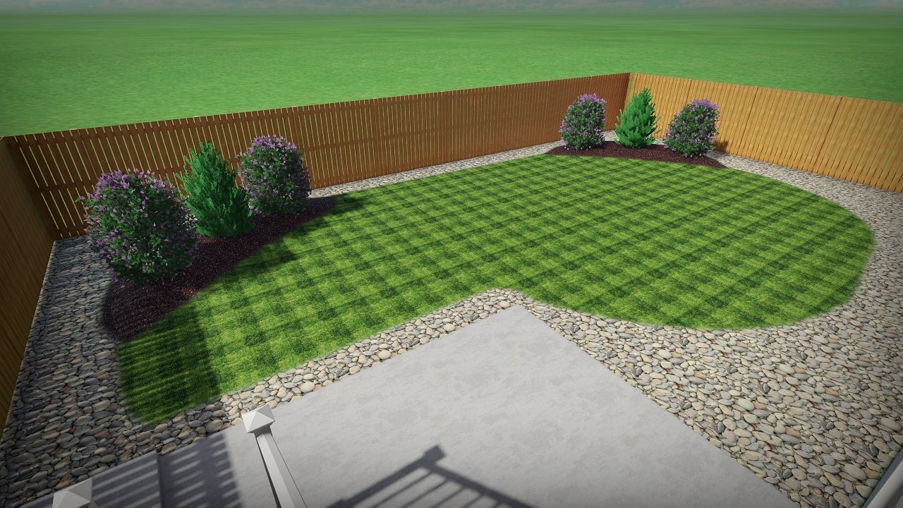 Backyard with a brown fence, green grass, mulch, gravel, and a concrete patio.