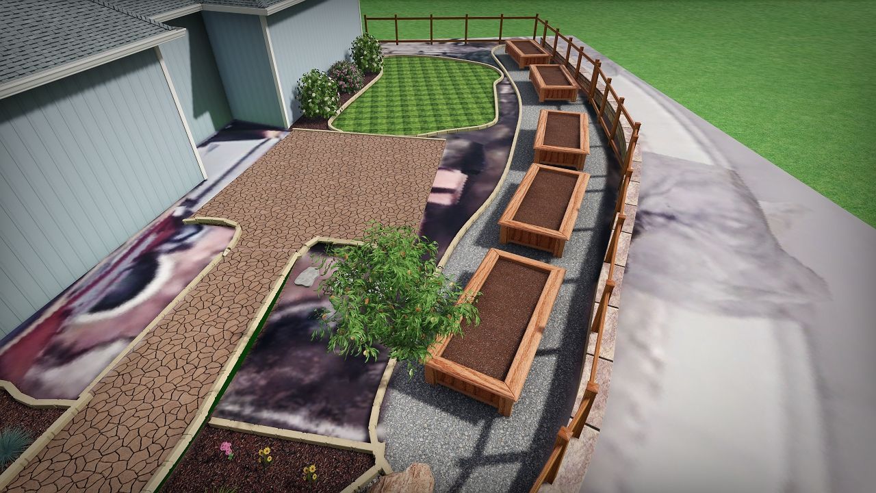 Overhead view of backyard with wooden raised garden beds, gravel paths, and a small lawn.