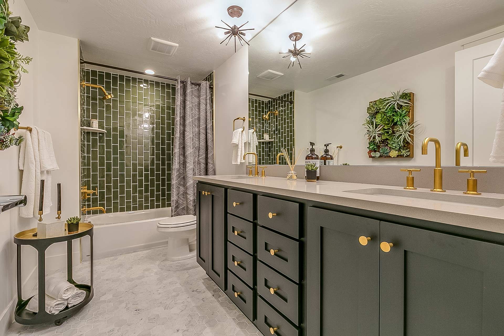 A bathroom with two sinks and a mirror