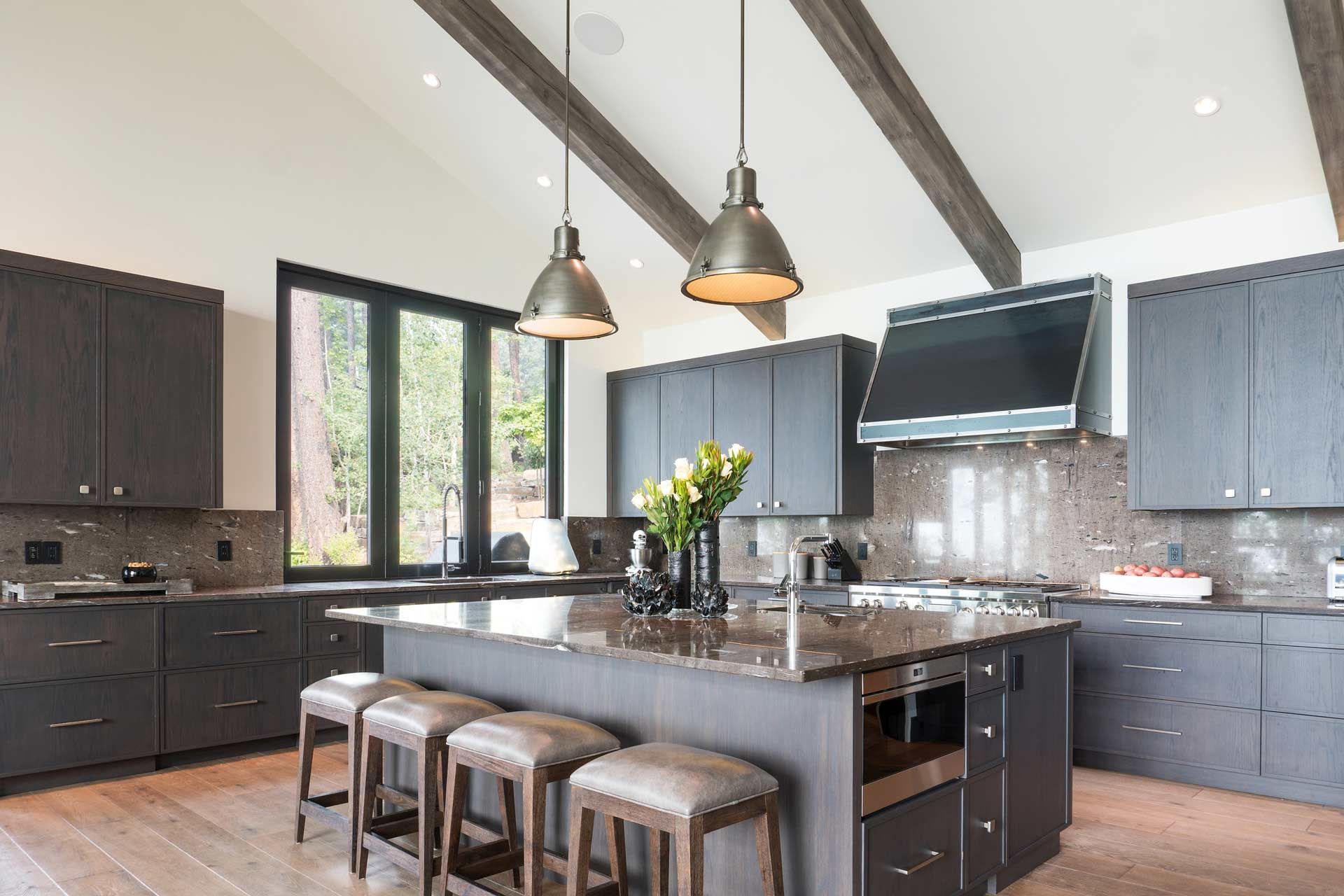 A large kitchen with a large island and stools