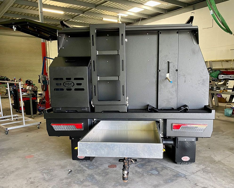 A trailer with a ladder and a drawer underneath it  — PSE Stainless Steel Fabrications in Manunda, QLD