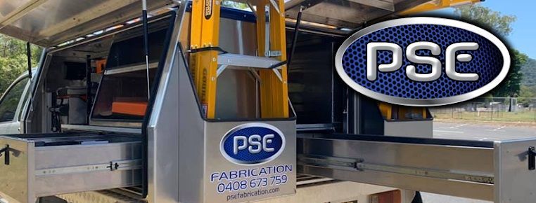 A Truck with A Ladder on The Back Is Parked on The Side of The Road — PSE Stainless Steel Fabrications in Manunda, QLD