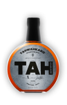 A close up of a bottle of tah on a white background.