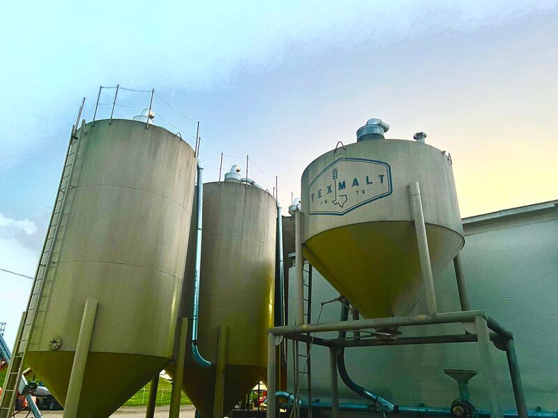A large silo with TexMalt on it