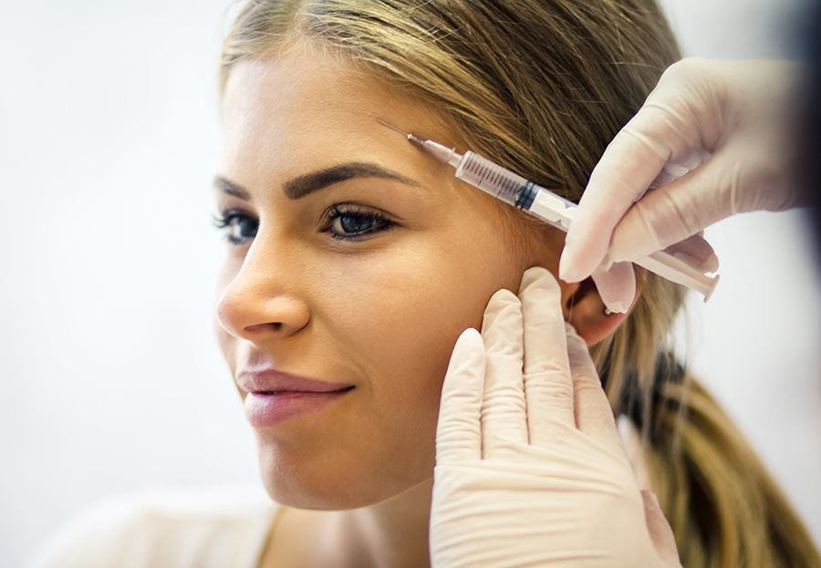 stock image of woman getting cosmetic injections