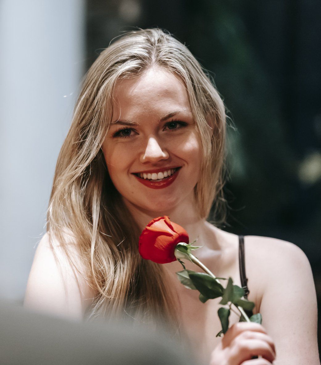 woman holding a rose