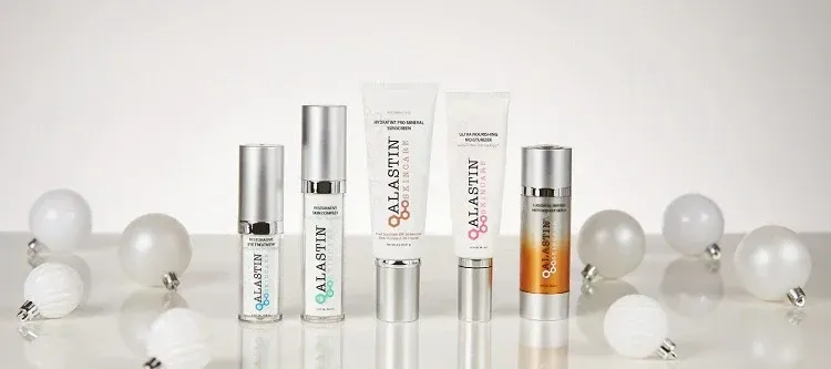 alastin skincare products surrounded by ornaments