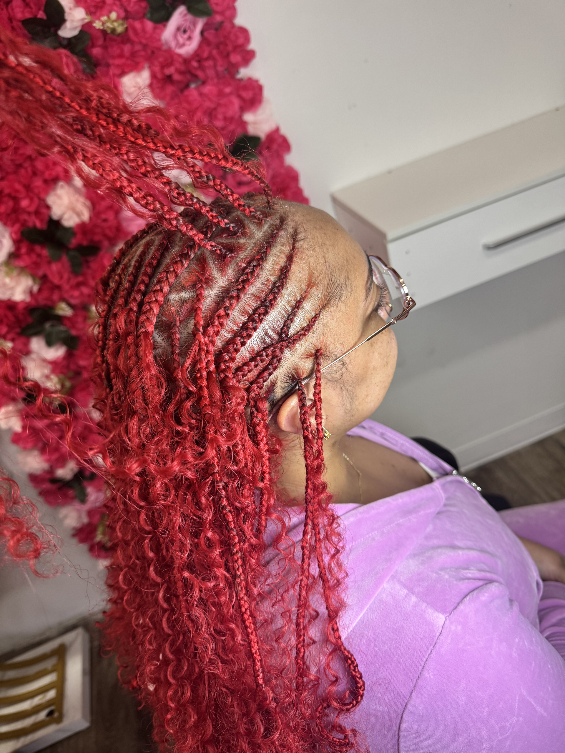 Close-up of long brown and black braided hair filling the frame.