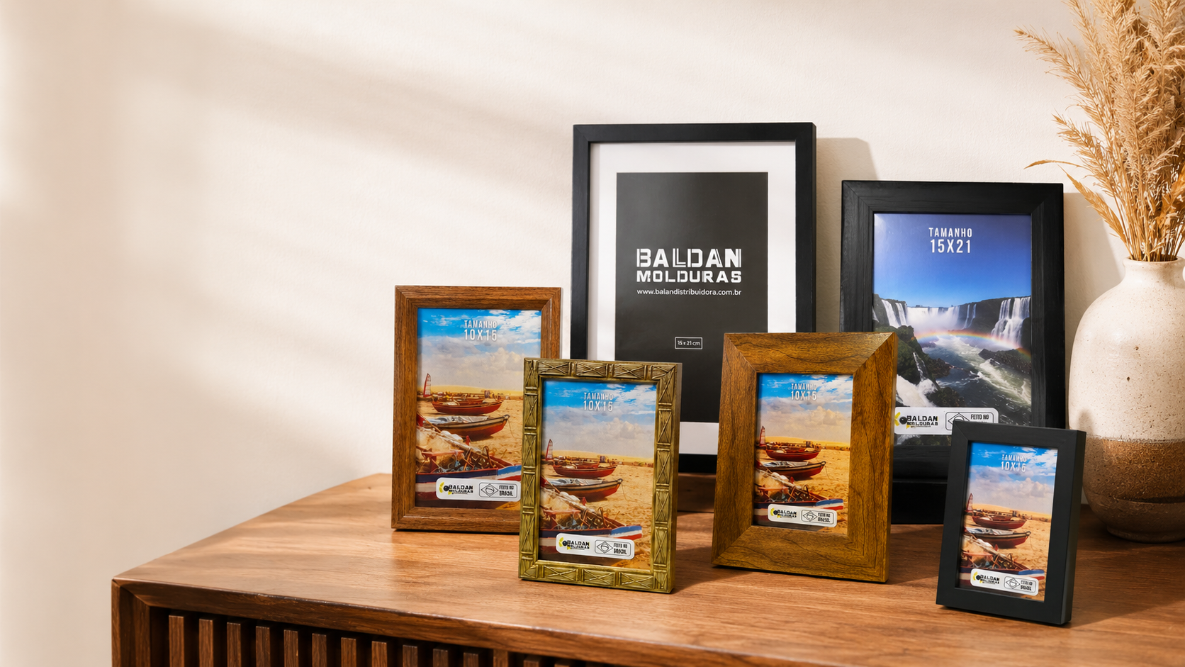 Assorted framed food package displays on a wooden table in a bright room