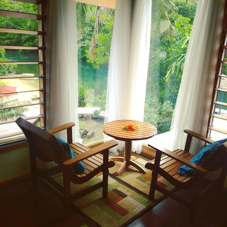 Two chairs and a table in front of a window