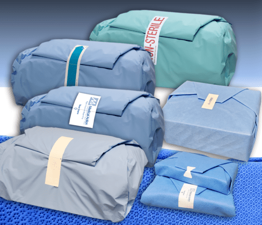 Stacked folded clothing bundles wrapped in blue, gray, and mint packaging ties