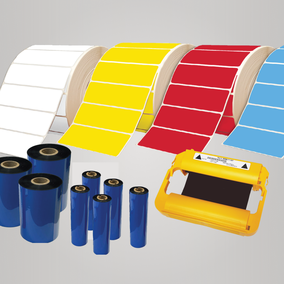 Colored adhesive label rolls and ribbon cartridges in white, yellow, red, blue, and black on a gray background