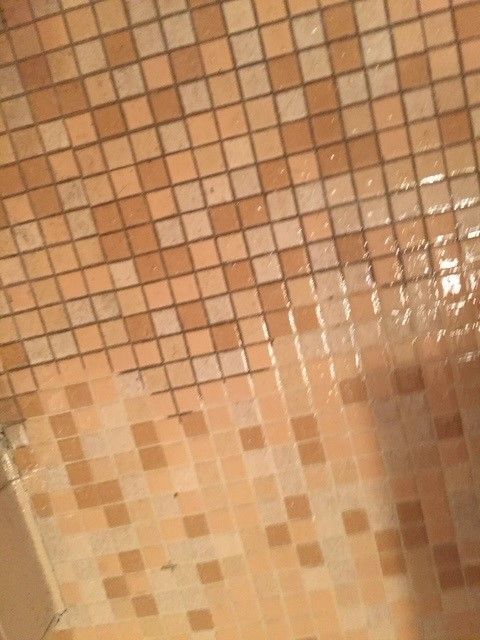 A close up of a tiled floor in a bathroom.