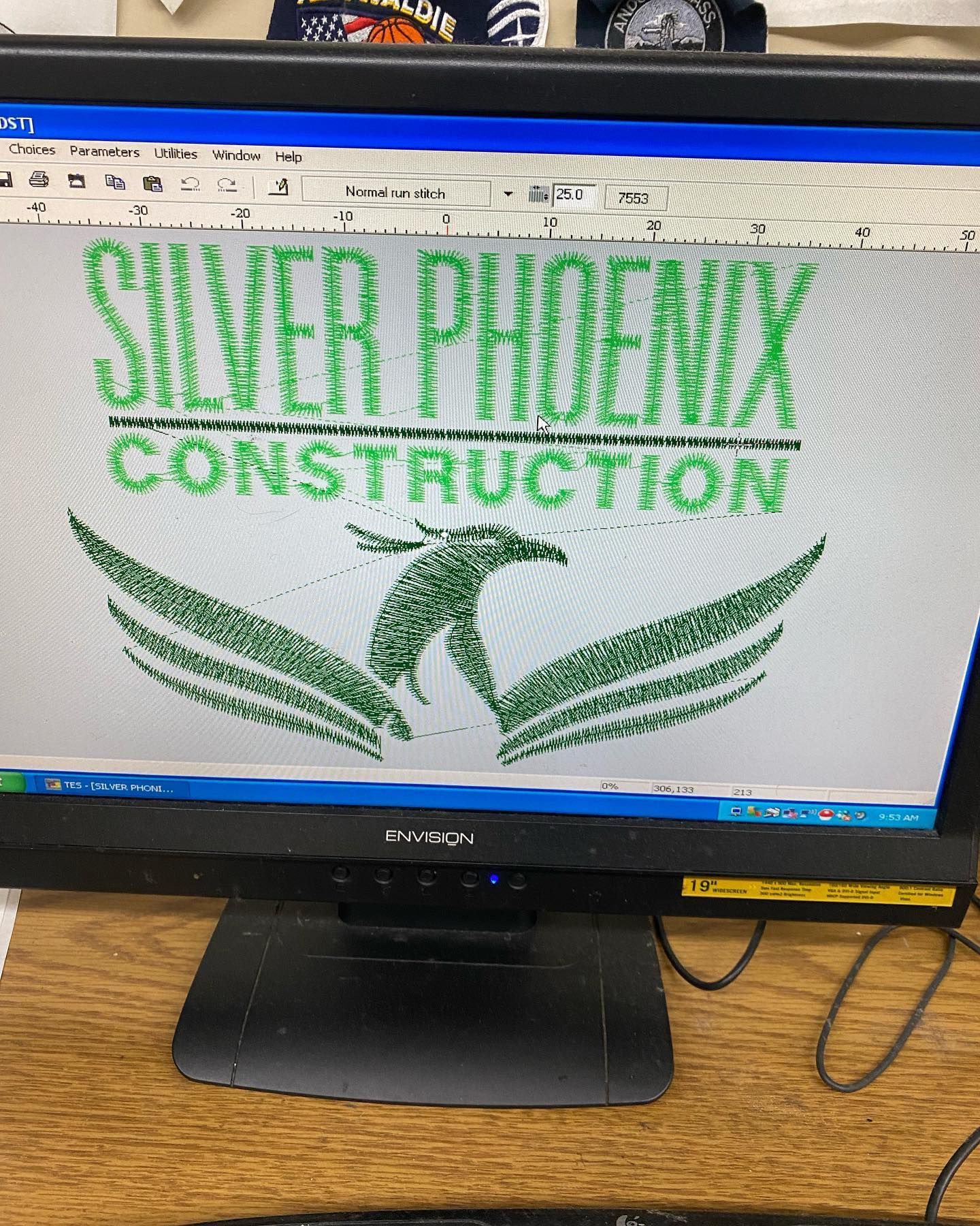Silver Phoenix Construction logo on a computer screen, featuring green text and a phoenix graphic.