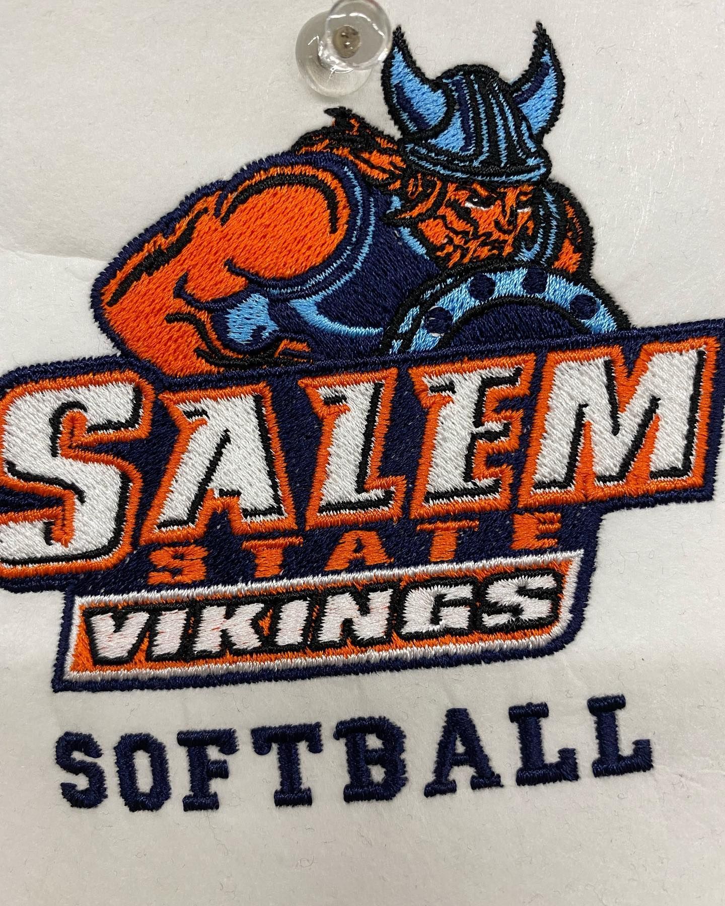 Embroidered Salem State Vikings softball logo with a blue and orange Viking mascot.