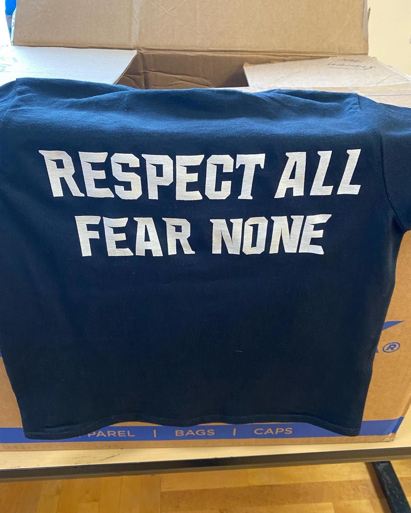 Black t-shirt with white text