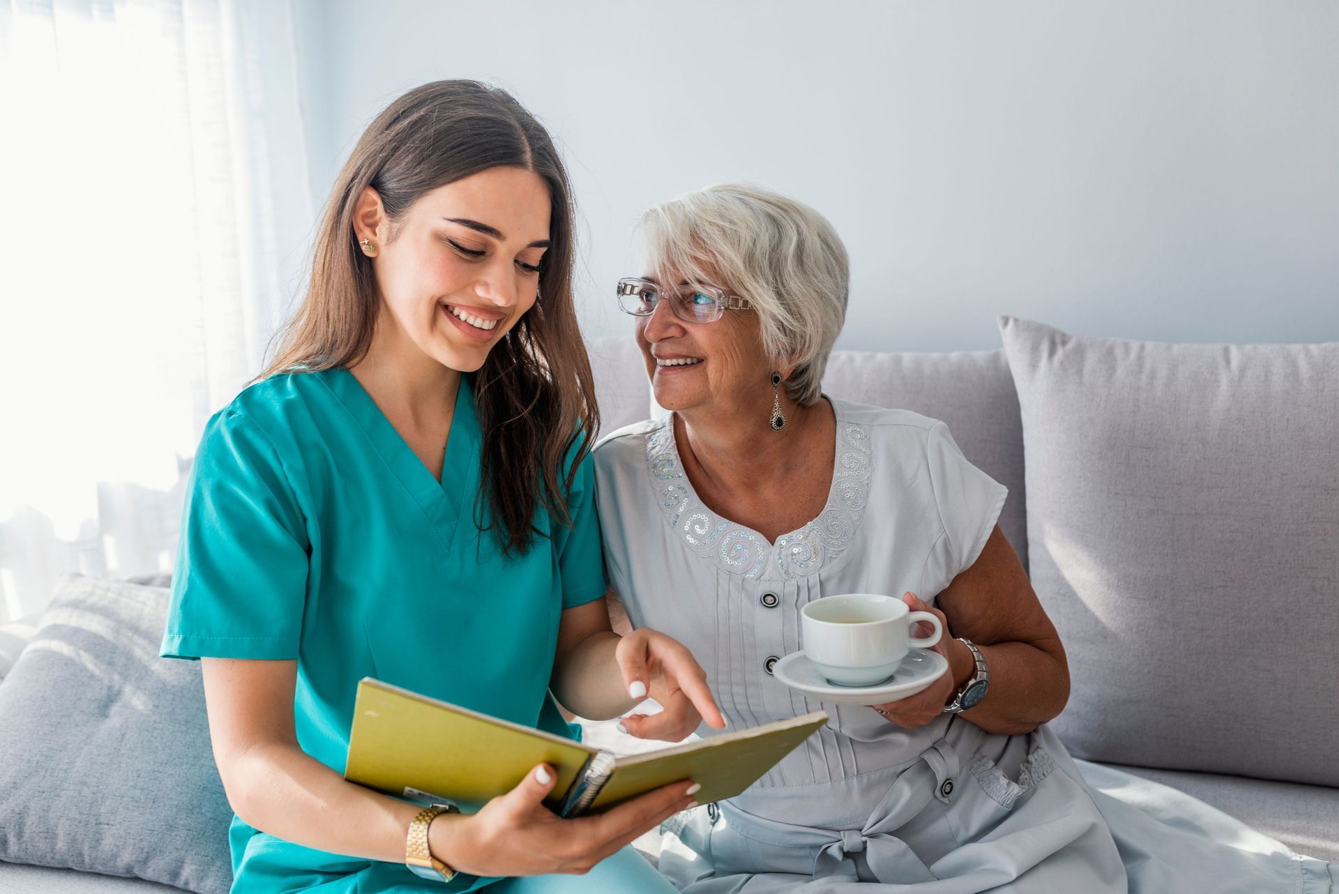 happy patient holding caregiver hand while
