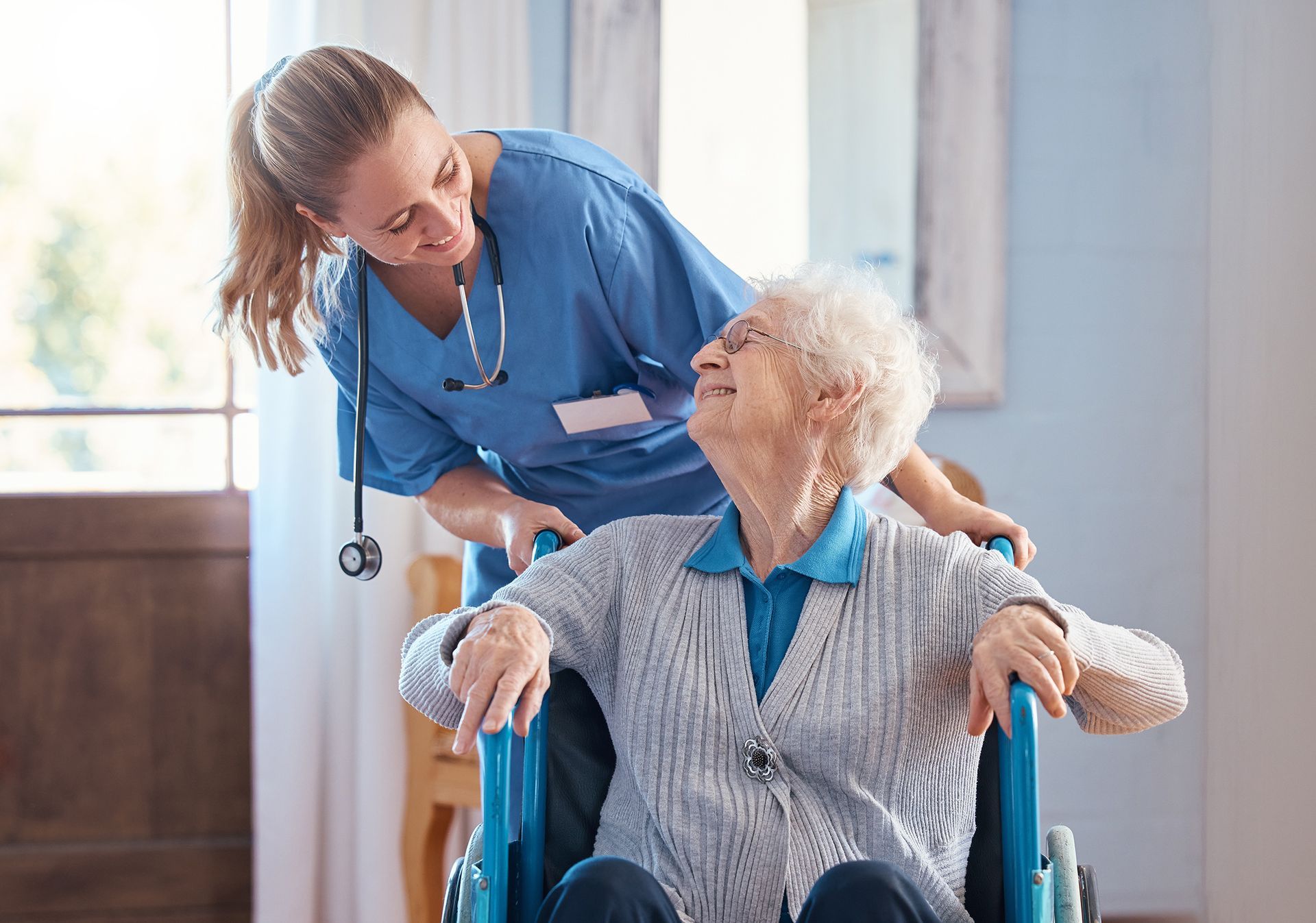 nurse home elderly woman disability wheelchair
