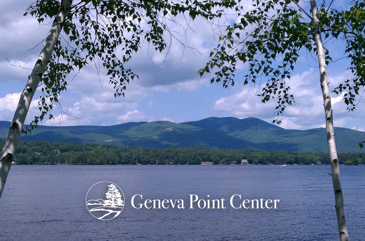 A lake with mountains in the background and the geneva point center logo