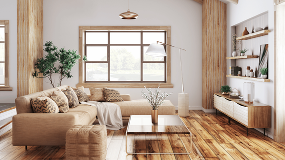 A living room with a couch , coffee table , and window.
