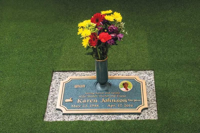 Tribute Bronze with vase for flowers that is flat on the ground at Hiwassee Memorial Gardens in TN