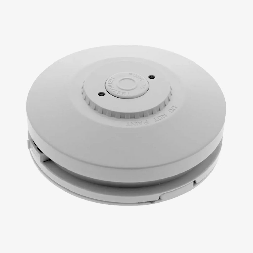 White Ceiling-mounted Smoke Detector With Circular Design — FNQ Smoke Alarms & Maintenance in Port Douglas, QLD