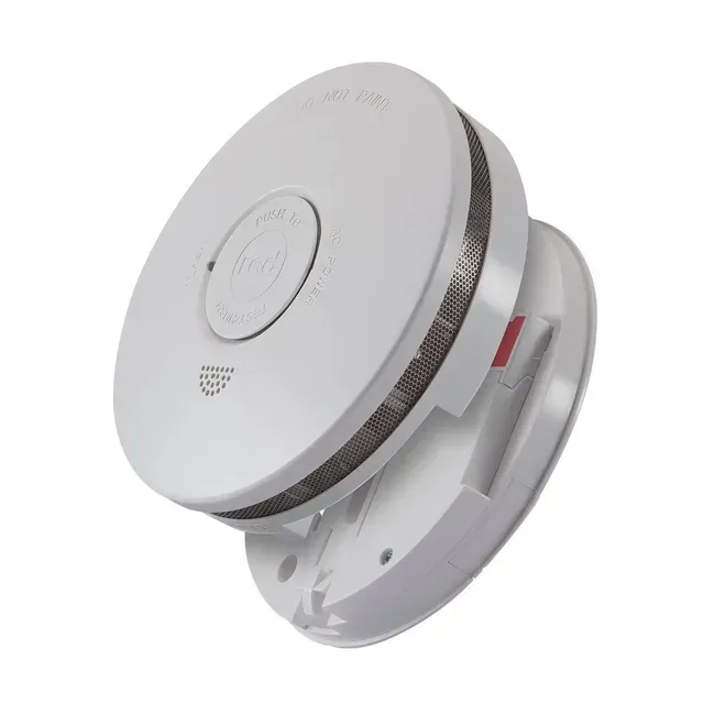 Smoke Detector With Model House and Blueprints — FNQ Smoke Alarms & Maintenance in Goldsborough, QLD