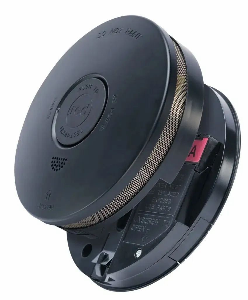 Black Smoke Detector, Open, With a Red Battery Tab Visible — FNQ Smoke Alarms & Maintenance in Cairns, QLD